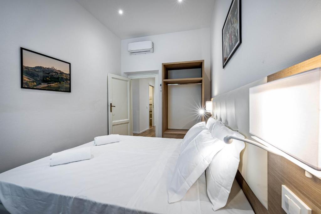 Letto o letti in una camera di YD elegant apt with garden
