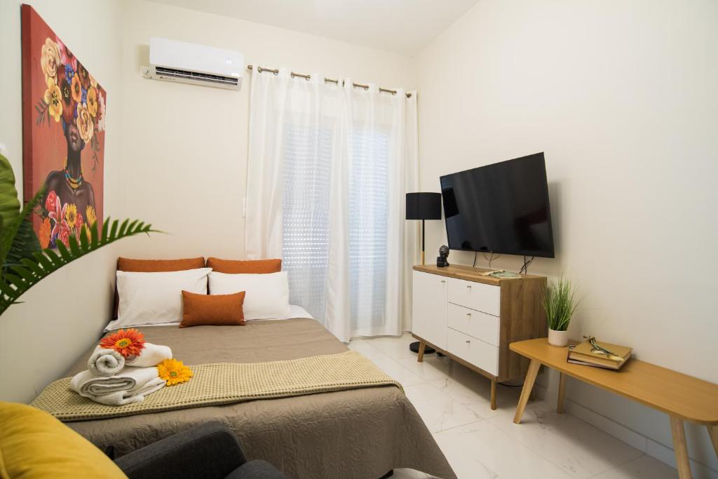 TV a/nebo společenská místnost v ubytování Aquamarine - Beach Flat