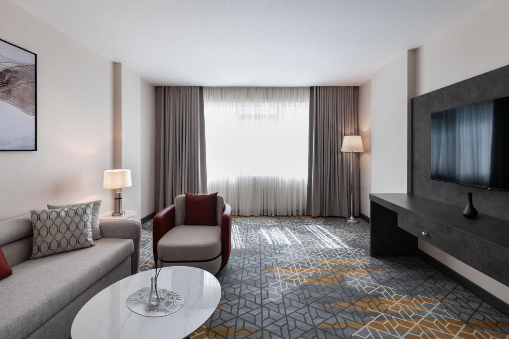 TV a/nebo společenská místnost v ubytování Enala Hotel- Umluj