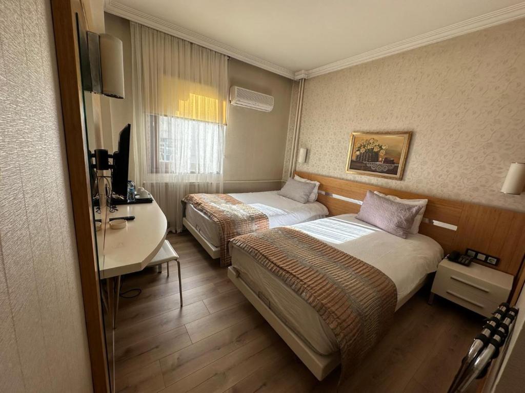 Postel nebo postele na pokoji v ubytování Sultan Hotel-Restaurant-Bistro