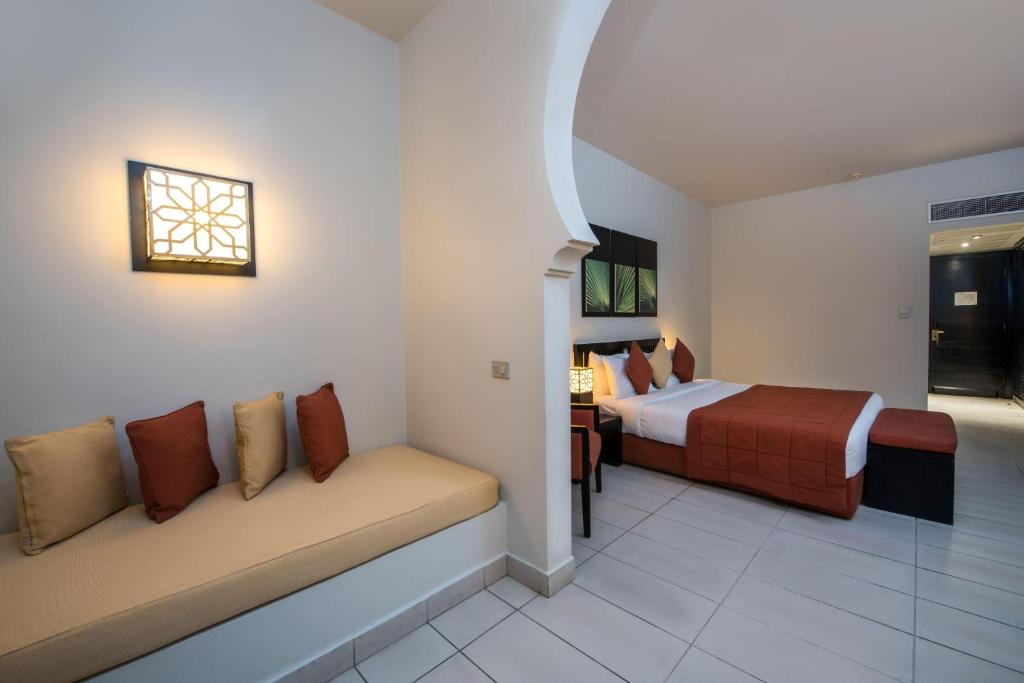 Кровать или кровати в номере Sentido Reef Oasis Aqua Park Resort