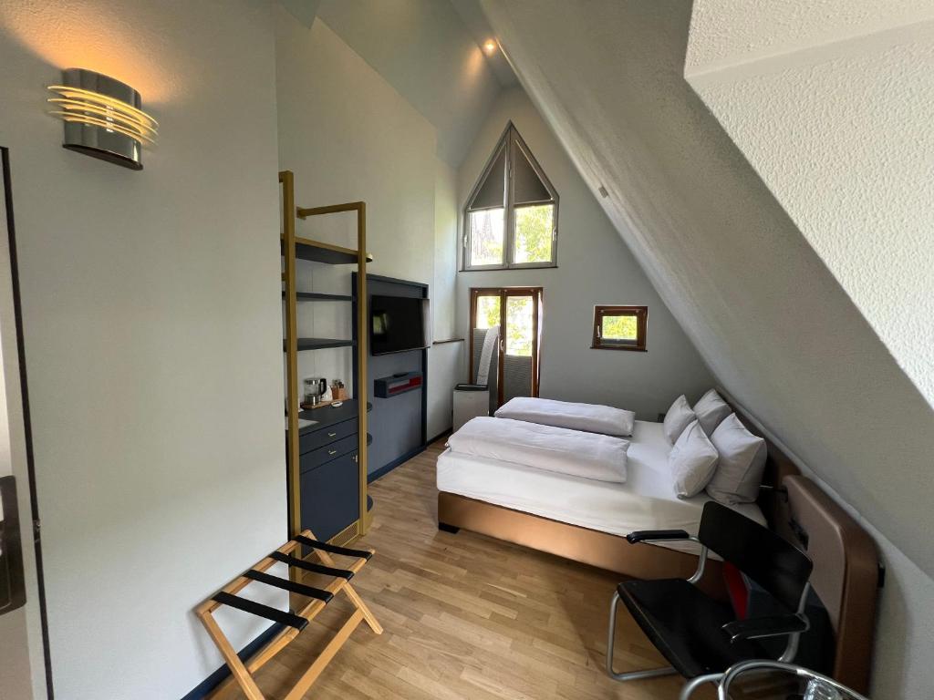Postel nebo postele na pokoji v ubytování Lint Hotel Köln
