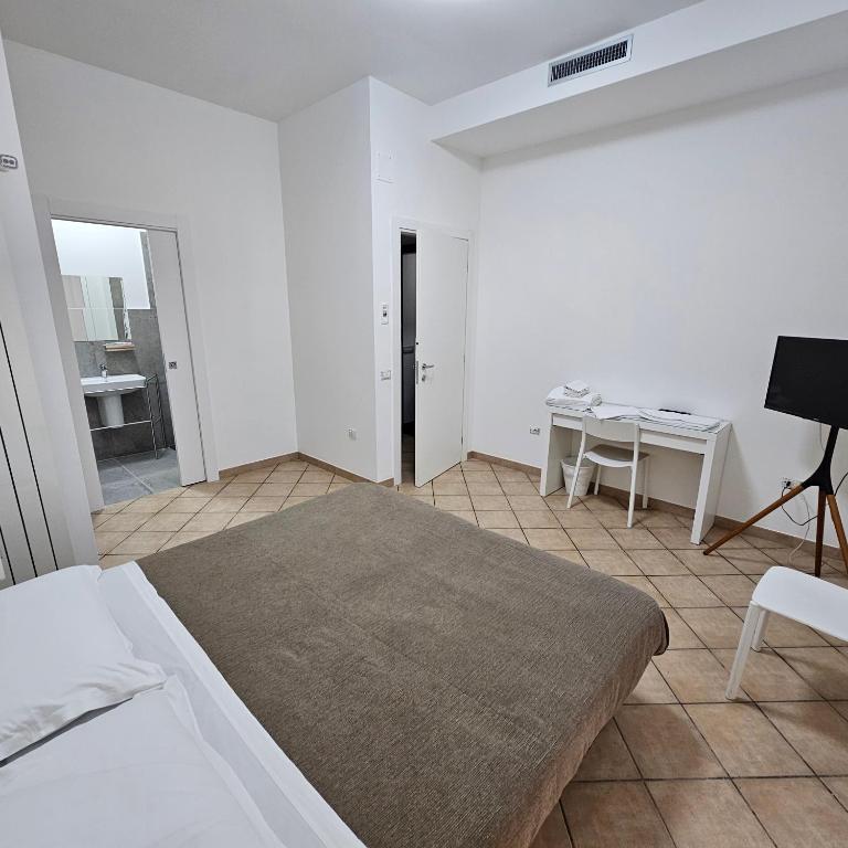 Postel nebo postele na pokoji v ubytování ROOM & PARKING in Centro Città con Parcheggio Privato e WIFI