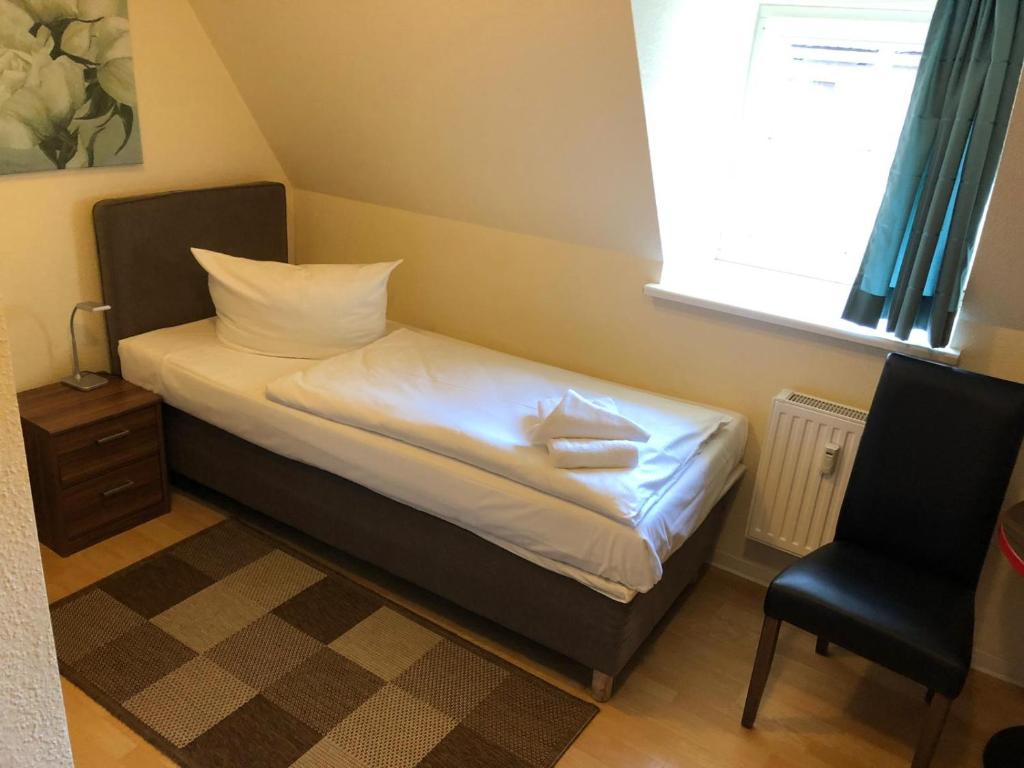 Postel nebo postele na pokoji v ubytování Hotel Am Hopfenmarkt