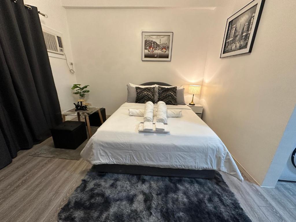 Ένα ή περισσότερα κρεβάτια σε δωμάτιο στο Davao City Studio Unit Condo near airport