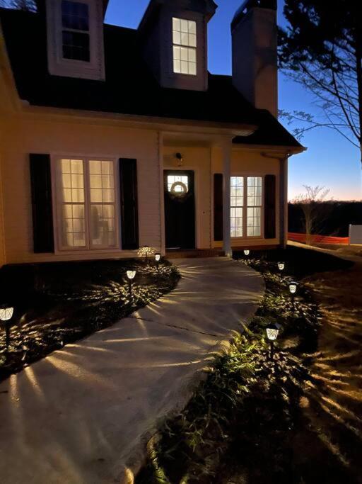 a house with a driveway in front of it at Lake Lanier House 1 in Gainesville