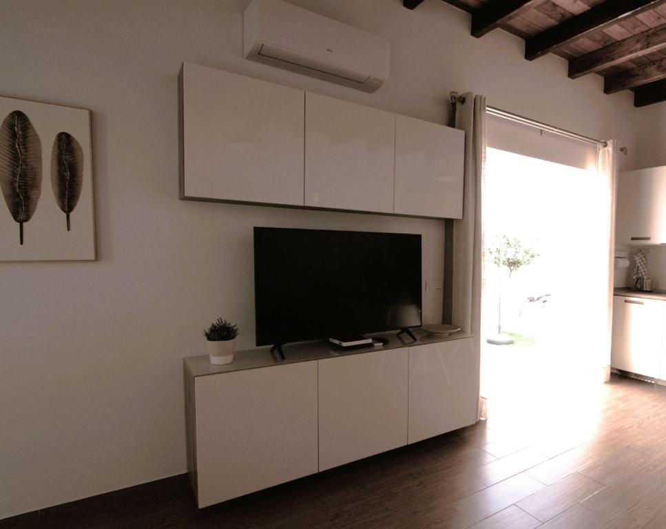 TV a/nebo společenská místnost v ubytování Casa Ita
