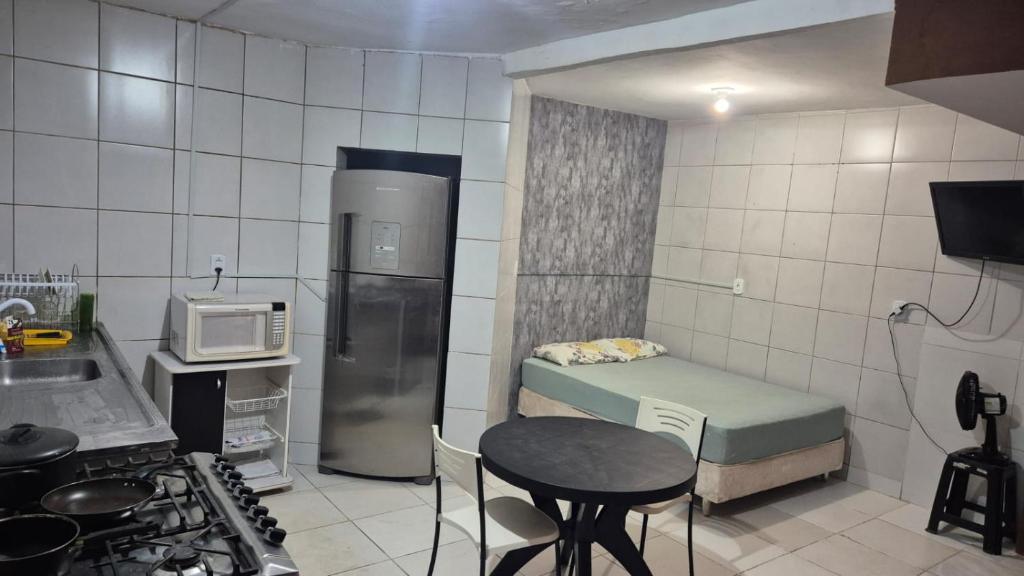 Køkken eller tekøkken på Kitnet Baião 400m Parque do Povo