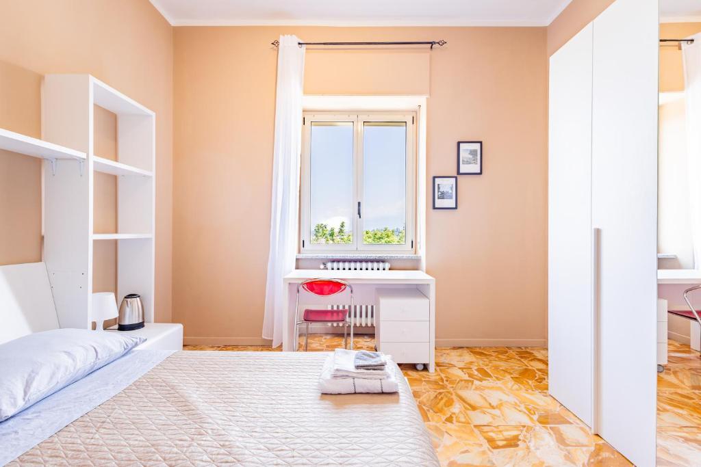 Postel nebo postele na pokoji v ubytování Casa Lungogesso