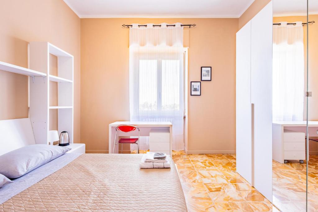 Postel nebo postele na pokoji v ubytování Casa Lungogesso
