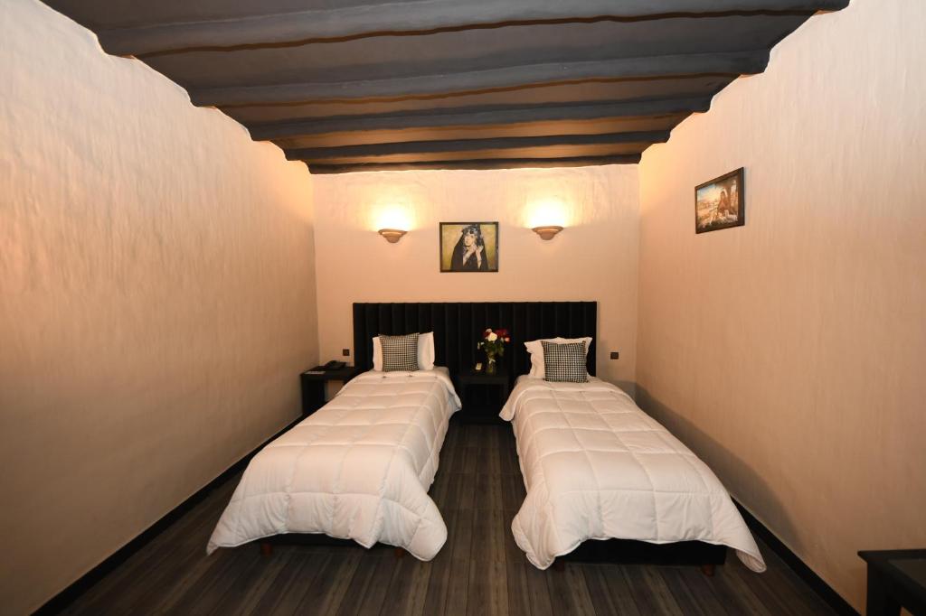 Postel nebo postele na pokoji v ubytování Agyad Maroc Appart-Hotel