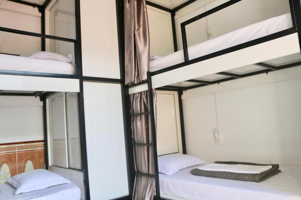 Postel nebo postele na pokoji v ubytování RiverView Homestay