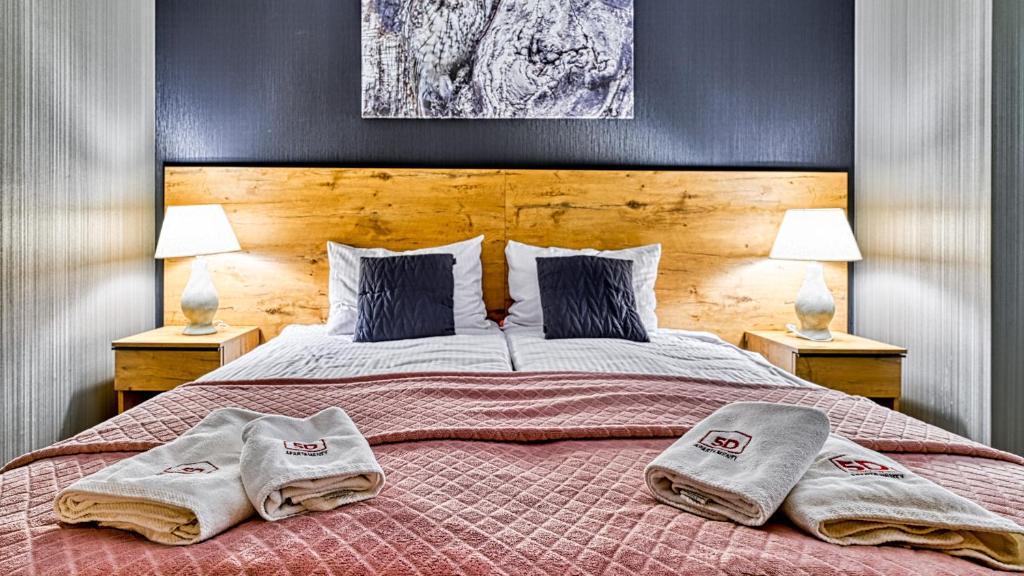 Posteľ alebo postele v izbe v ubytovaní Apartament SPA 44 Resort Kozubnik blisko Szczyrk- 5D Apartamenty