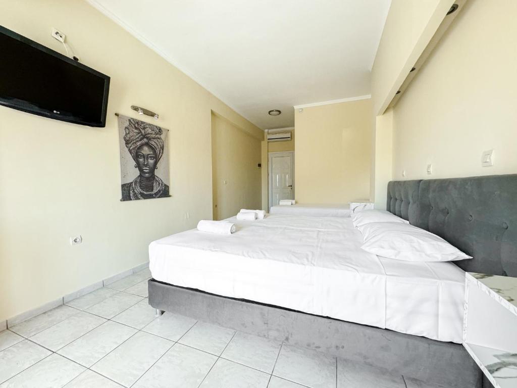 Postel nebo postele na pokoji v ubytování Kavos Plaza Hotel