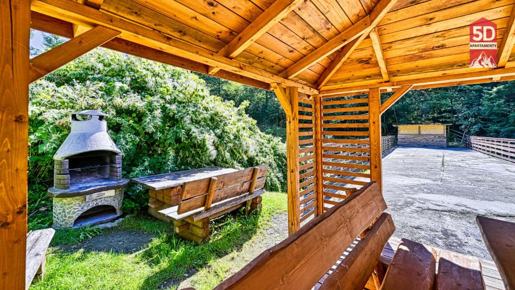 Vonkajšia záhrada v ubytovaní Apartament SPA 44 Resort Kozubnik blisko Szczyrk- 5D Apartamenty