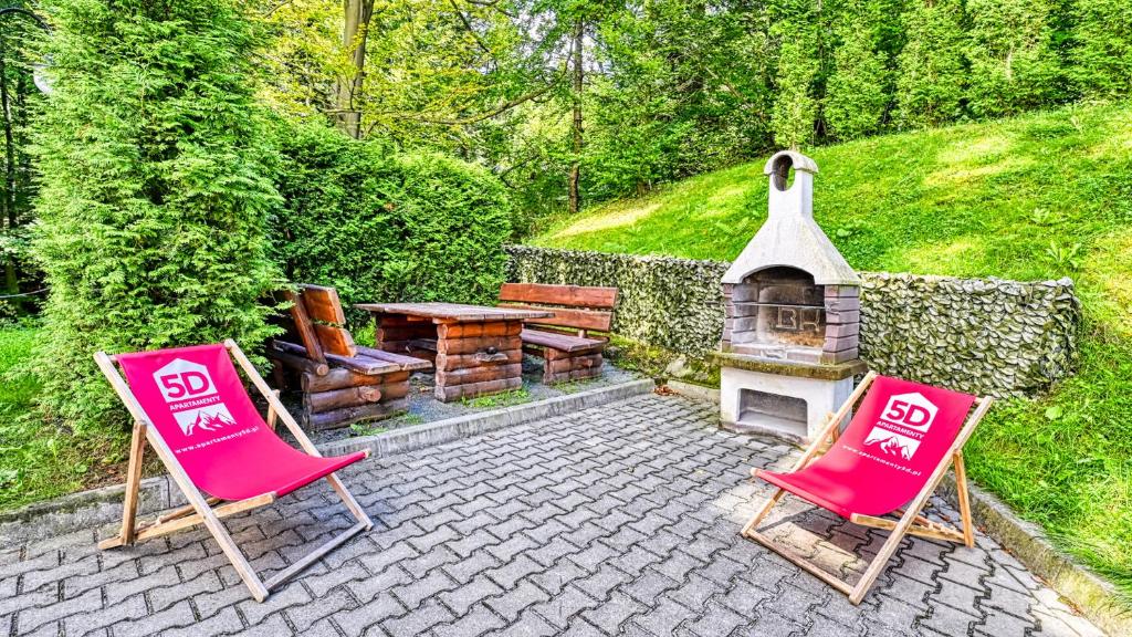 Vonkajšia záhrada v ubytovaní Apartament SPA 44 Resort Kozubnik blisko Szczyrk- 5D Apartamenty