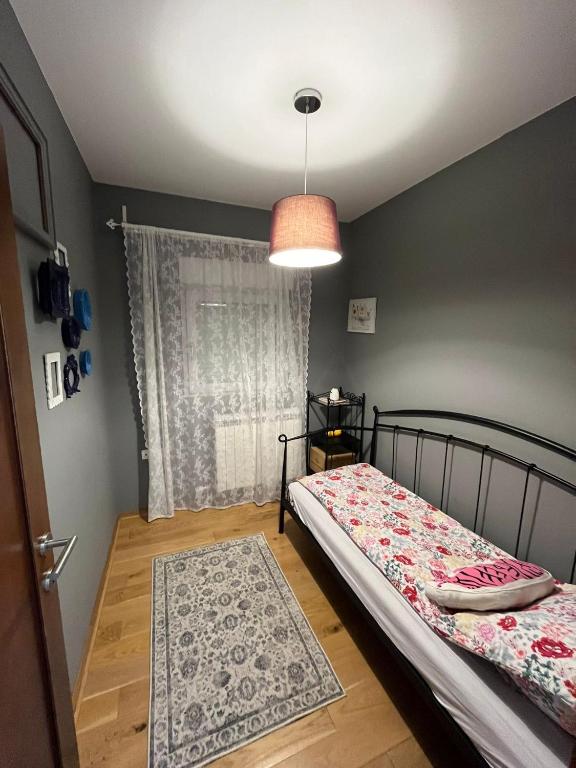 Una cama o camas en una habitación de Apartman Jana 1
