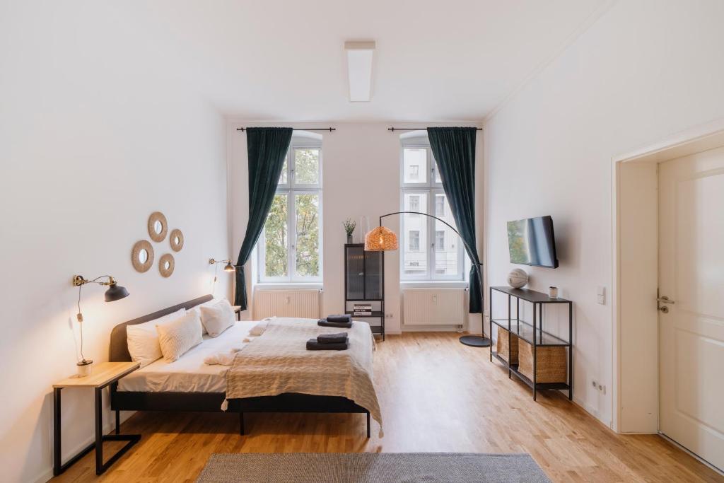 Ένα ή περισσότερα κρεβάτια σε δωμάτιο στο Homely Berlin - Chic Flat, City View, Subway, Café, River