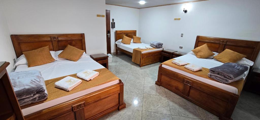 Postel nebo postele na pokoji v ubytování HOTEL EL VALENCIA