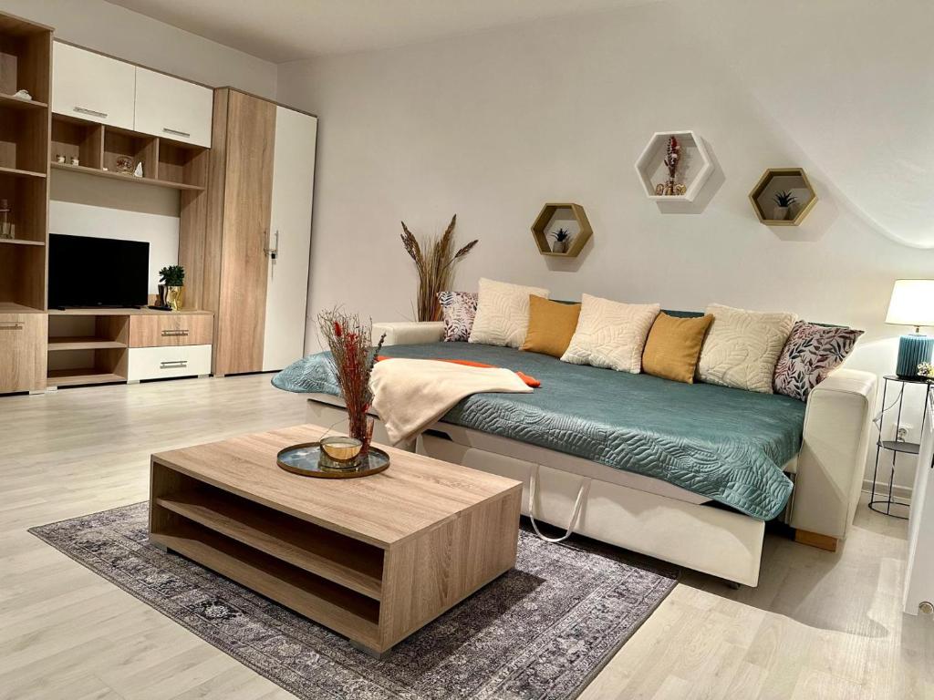 a living room with a couch and a coffee table at Saule in Ventspils