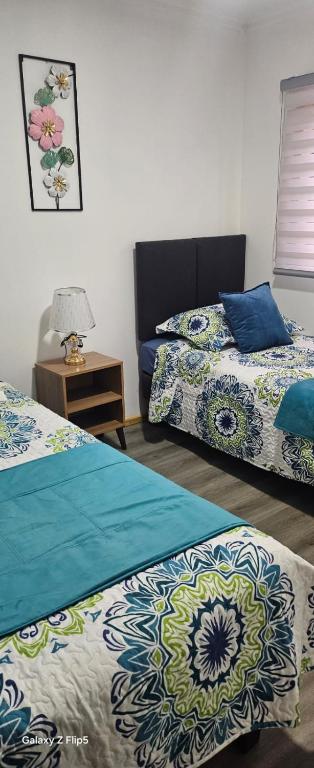Cama o camas de una habitación en Cabañas Licanantay