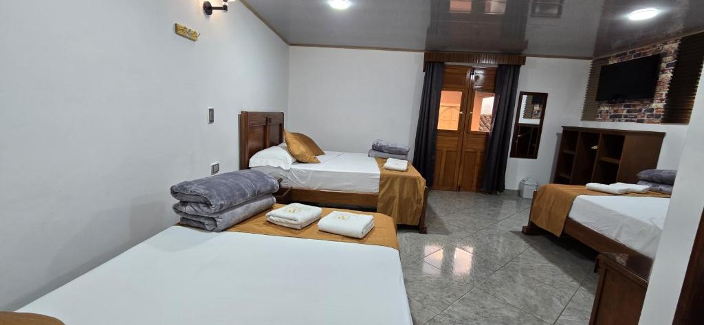 Postel nebo postele na pokoji v ubytování HOTEL EL VALENCIA