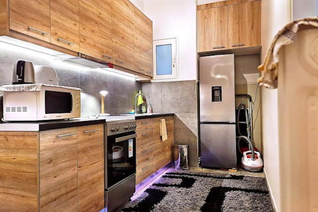 Kuchyň nebo kuchyňský kout v ubytování Modern apartment in Neo Faliro