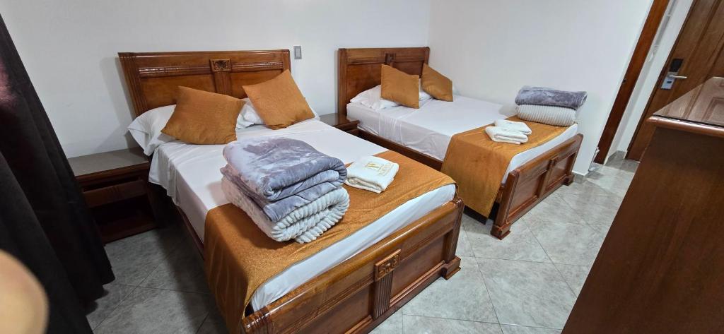 Postel nebo postele na pokoji v ubytování HOTEL EL VALENCIA