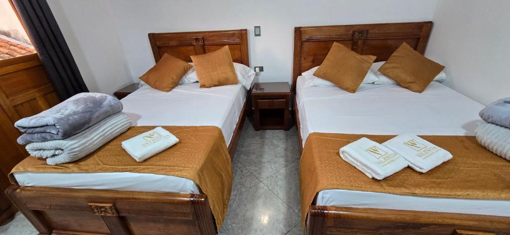Postel nebo postele na pokoji v ubytování HOTEL EL VALENCIA