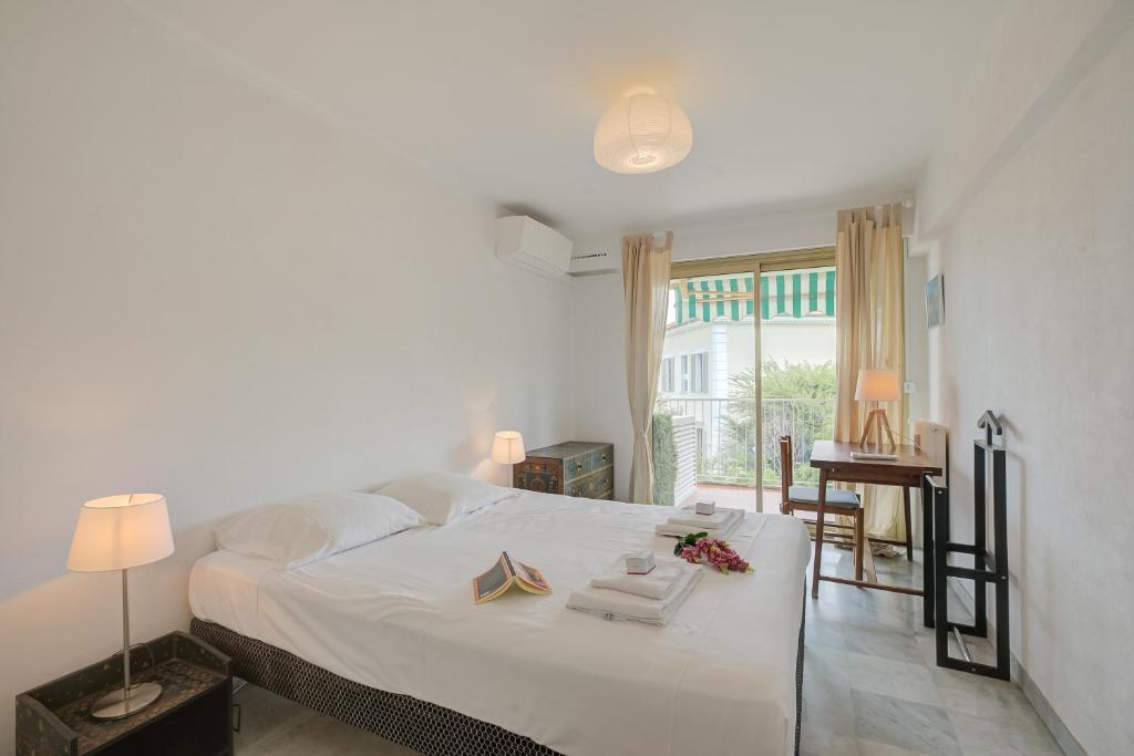 Posteľ alebo postele v izbe v ubytovaní L'Ermitage - Happy Rentals
