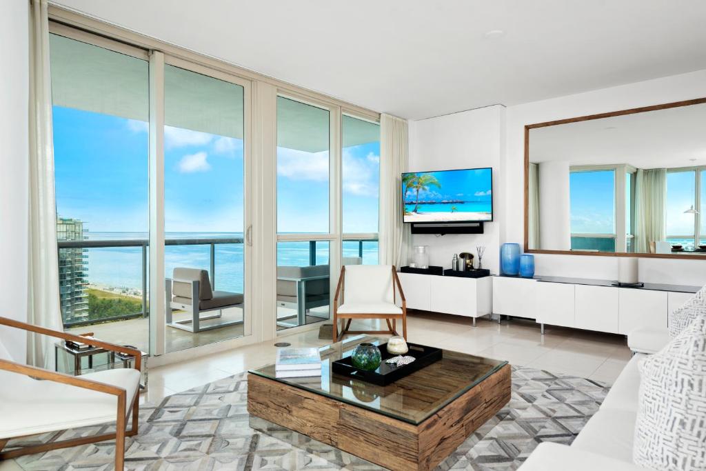 a living room with a view of the ocean at Oceanview Private Condo at The Setai -2401 in Miami Beach