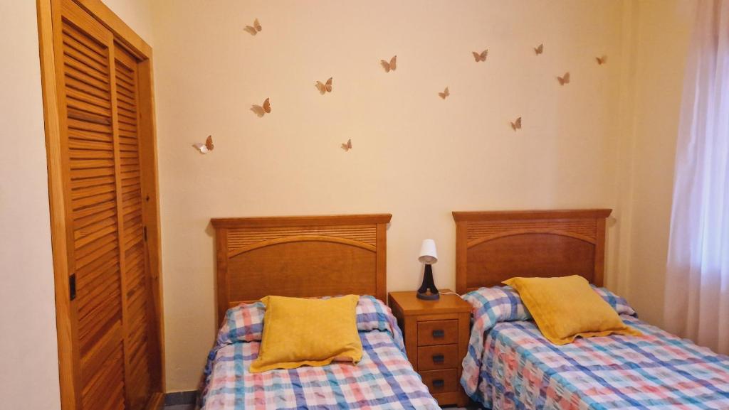 Postel nebo postele na pokoji v ubytování Chalet Playa Chilches