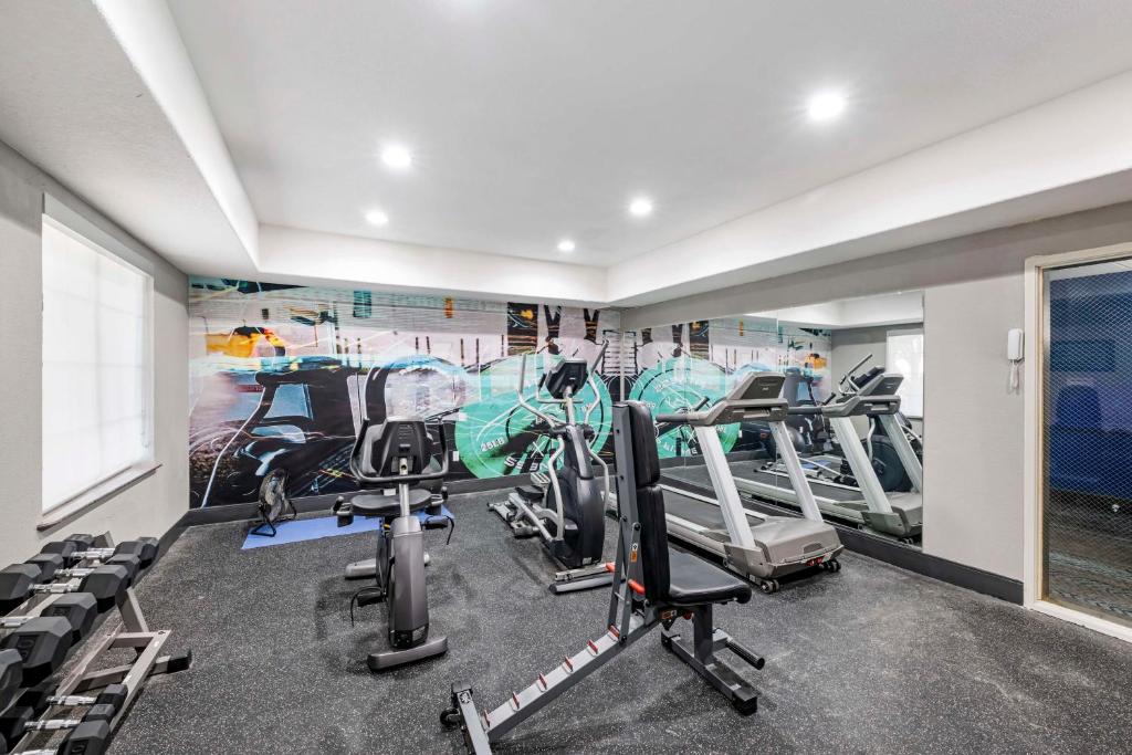a gym with treadmills and ellipticals in a room at Best Western Lubbock West Inn & Suites in Lubbock