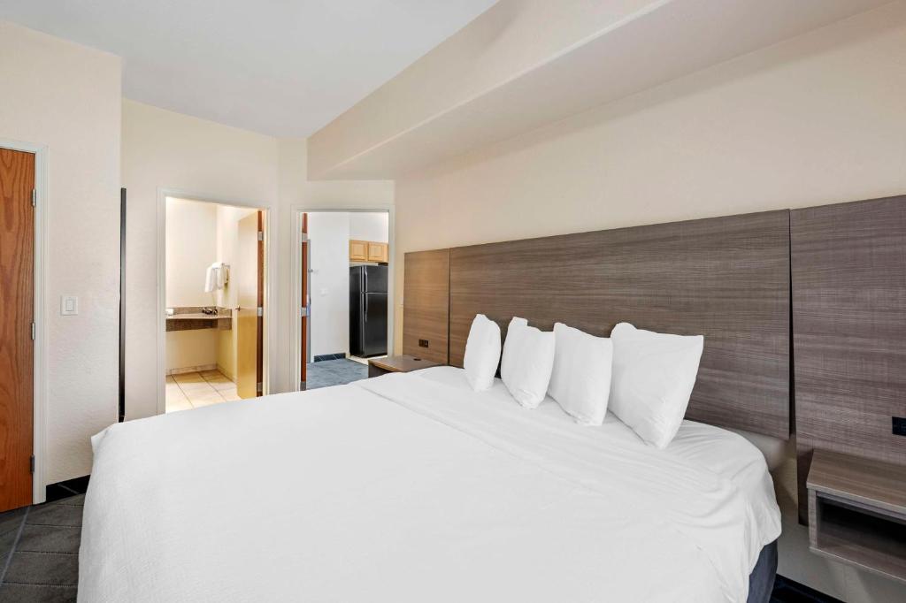 a large white bed in a hotel room at Best Western Lubbock West Inn & Suites in Lubbock