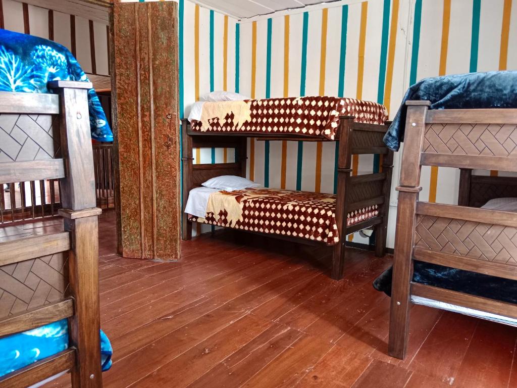 Postel nebo postele na pokoji v ubytování Hostal Casa Celeste