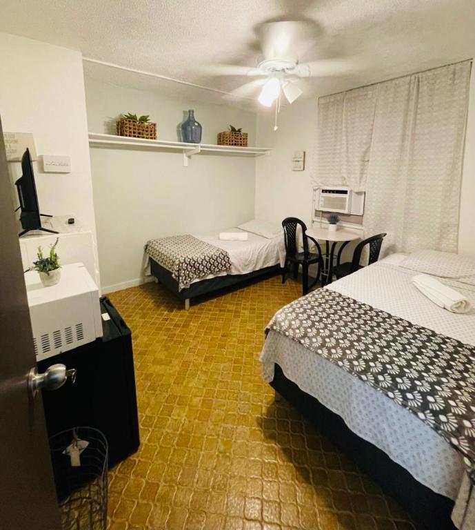 Postel nebo postele na pokoji v ubytování Cozy Room with 2 twin beds in SanJuan metro area