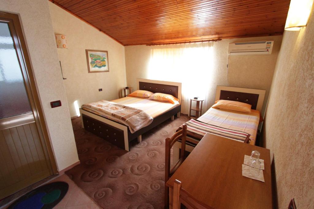 Postel nebo postele na pokoji v ubytování Alen Bar Hotel