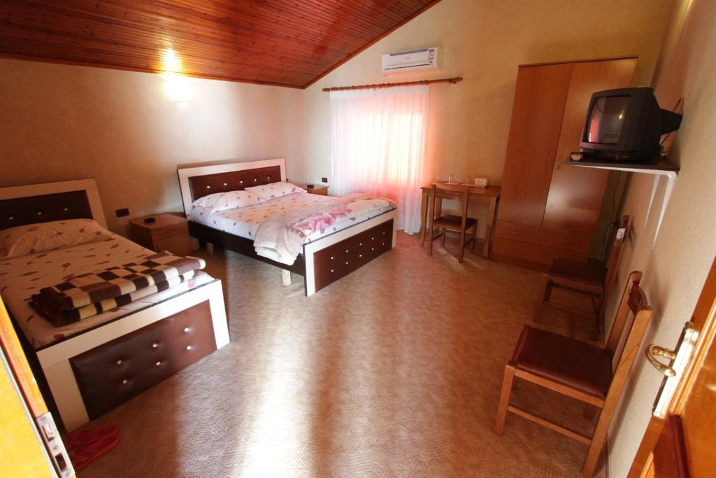 Postel nebo postele na pokoji v ubytování Alen Bar Hotel