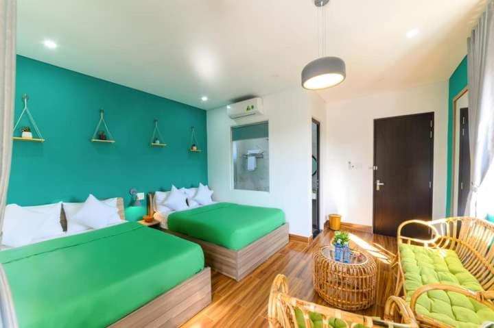 Postel nebo postele na pokoji v ubytování Kivi Homestay Hoi An
