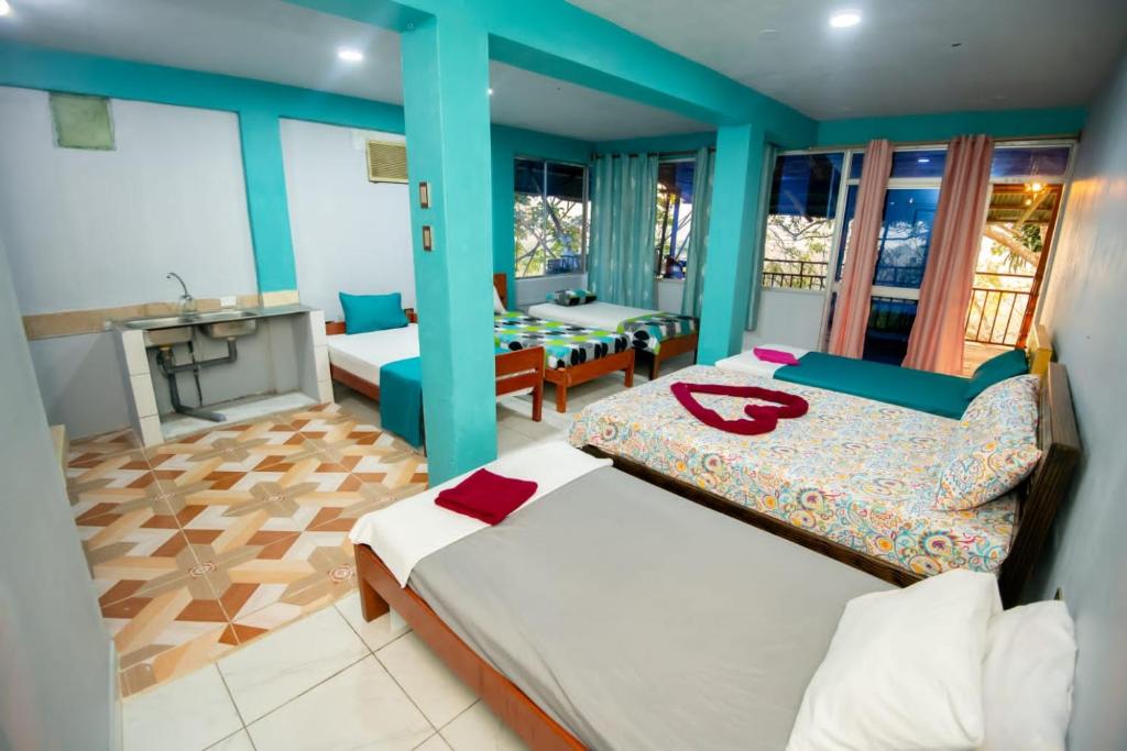 Postel nebo postele na pokoji v ubytování Hospedaje AB Iquitos