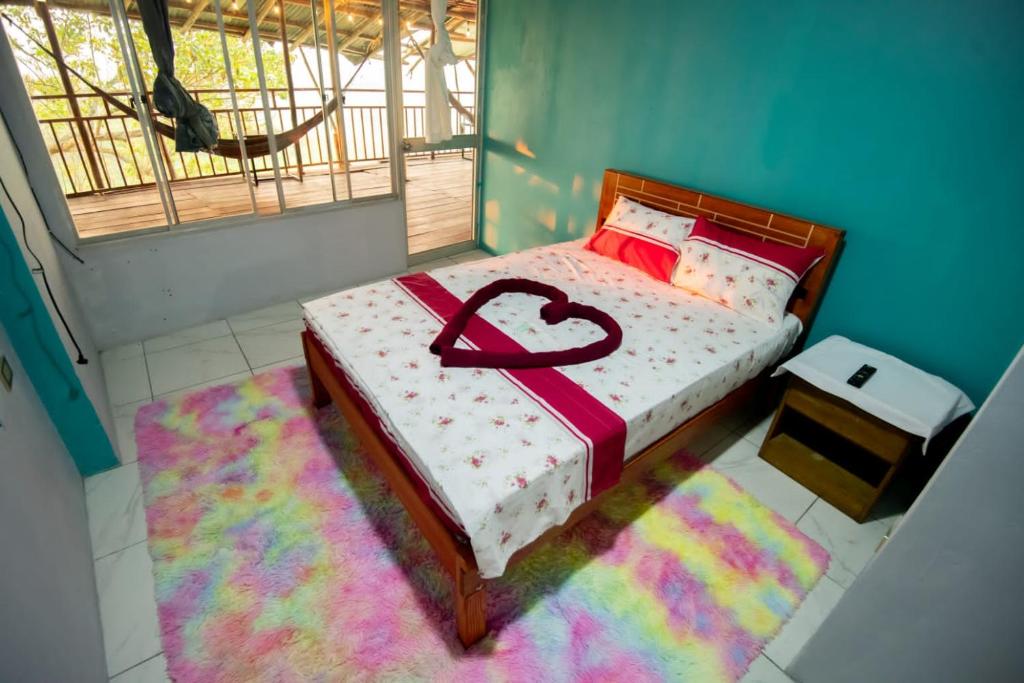 Postel nebo postele na pokoji v ubytování Hospedaje AB Iquitos