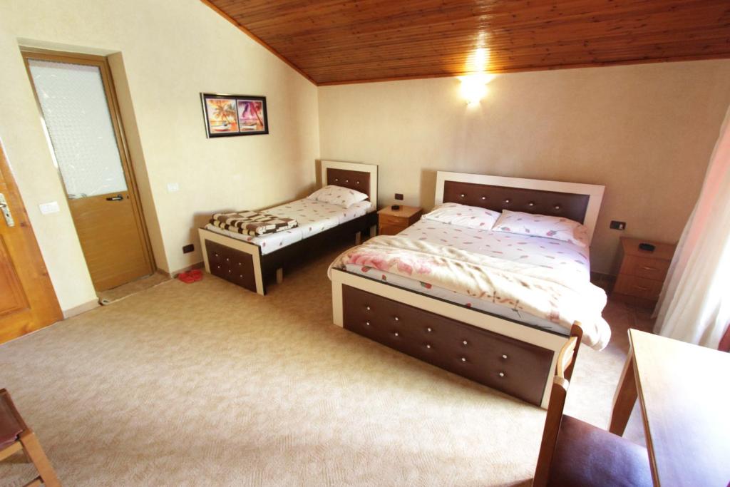 Postel nebo postele na pokoji v ubytování Alen Bar Hotel