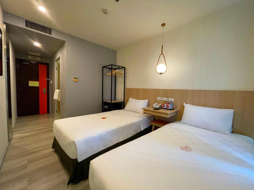 Postel nebo postele na pokoji v ubytování Go Hotels Plus Mandaluyong