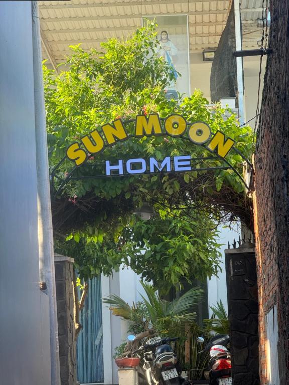 a sun moon home sign in front of a building at Home Sun Moon - Phòng Đôi in Phan Thiet