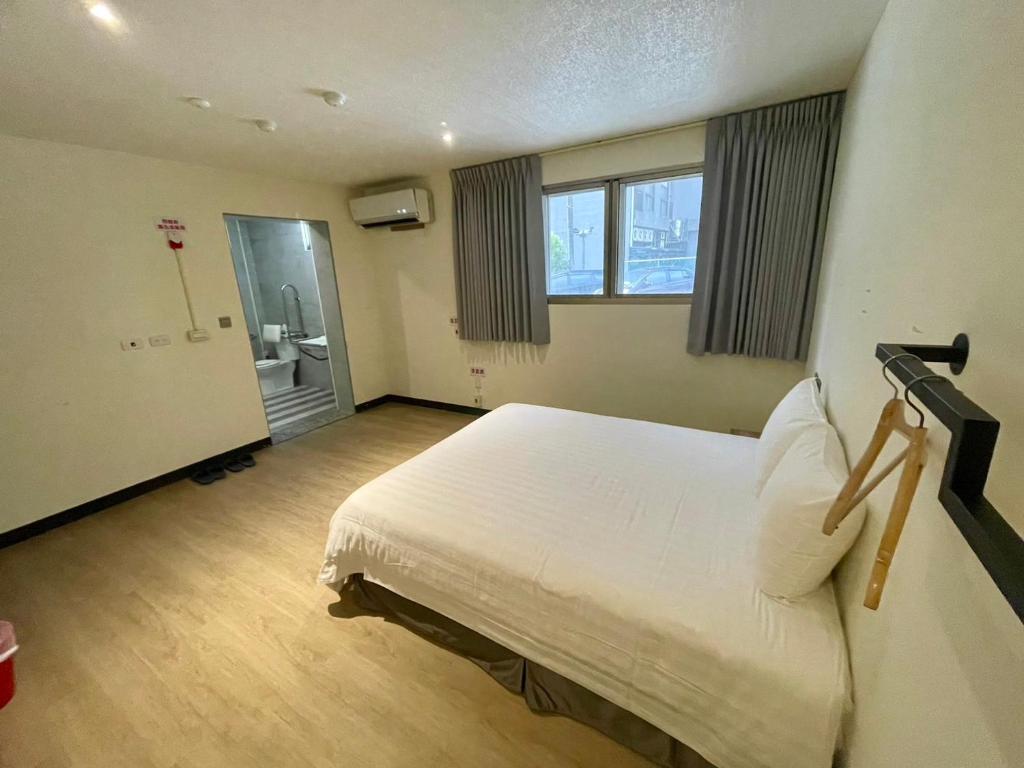 Postel nebo postele na pokoji v ubytování Prince Hotel