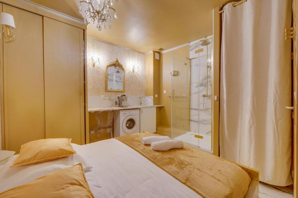 a bathroom with a large bed and a shower at Compact City-Centre Studio with Parking and Wi-Fi in Bordeaux