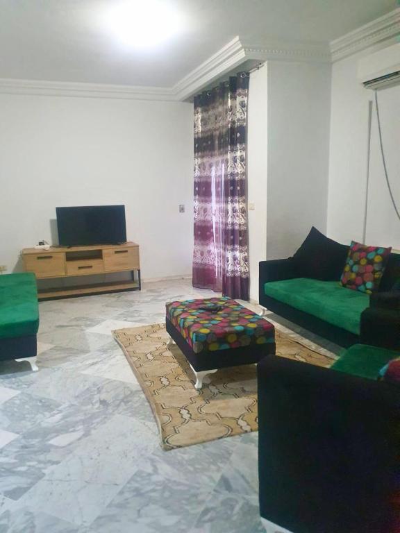 Posezení v ubytování Belle 2 Chambres avec Internet - Ennasr 2 Hedi Nouira - Parfait Pour Les familles - Vue panoramique