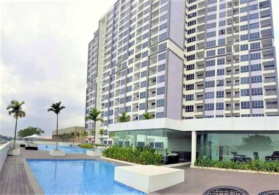 a rendering of a building with a swimming pool at Near Ferry Terminal - Lovely 2 Bedroom Condo - Harbourbay Residences - 0608 in Tanjunguma