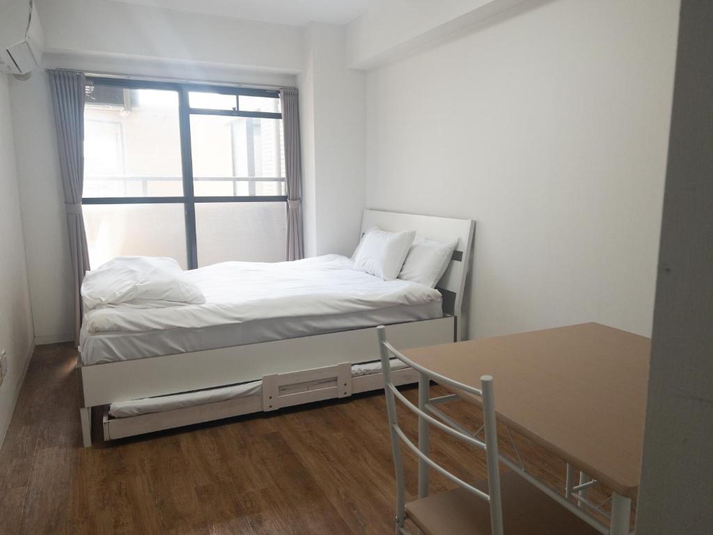 Postel nebo postele na pokoji v ubytování HARMONY HOTEL Urawa