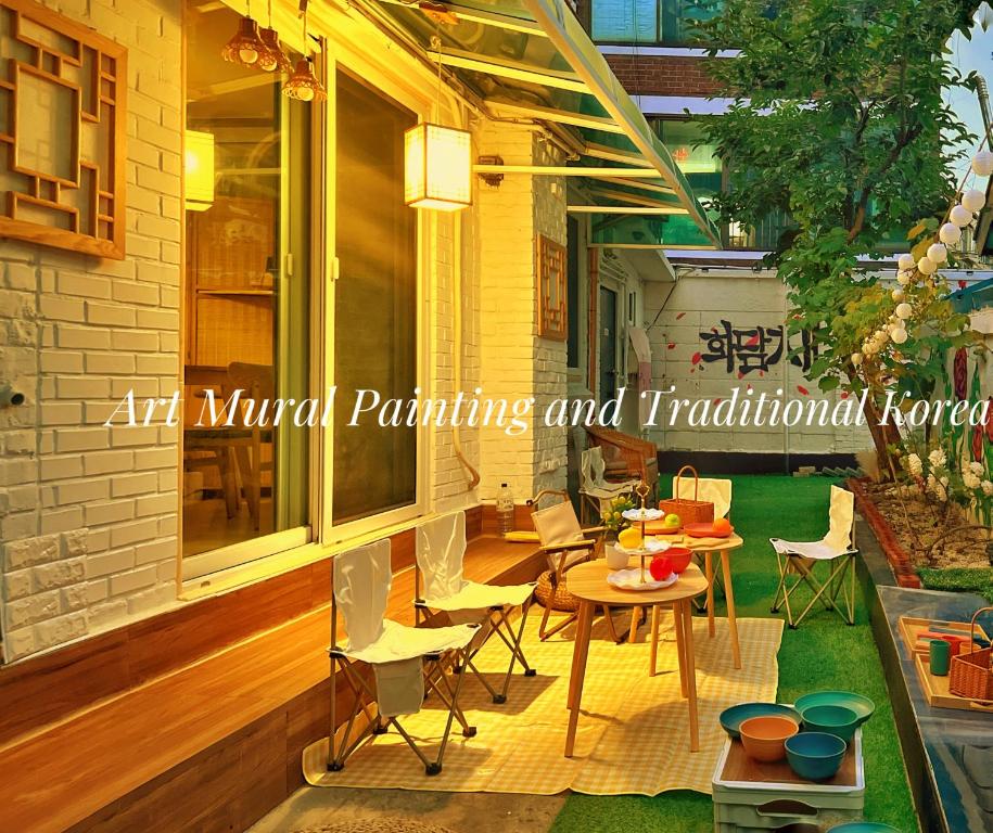 an outdoor patio with a table and chairs at Private Korean Entire Villa with Garden up to 10 in Seoul
